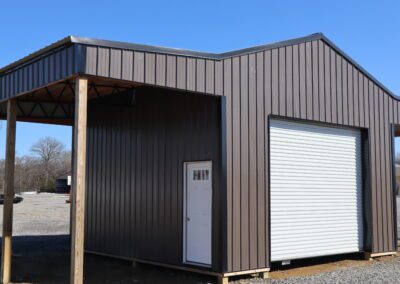 New construction house with exposed wooden framework and wrapped insulation, featuring windows and a door.
